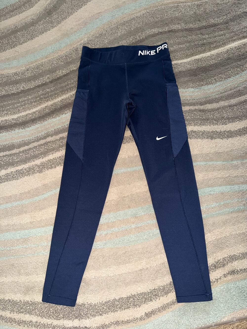 Medium pair of Nike Pro Therma-FIT Women's Mid-Rise Pocket Leggings